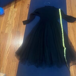 Elegant Black Long Sleeve sweater Dress with tuille skirt.